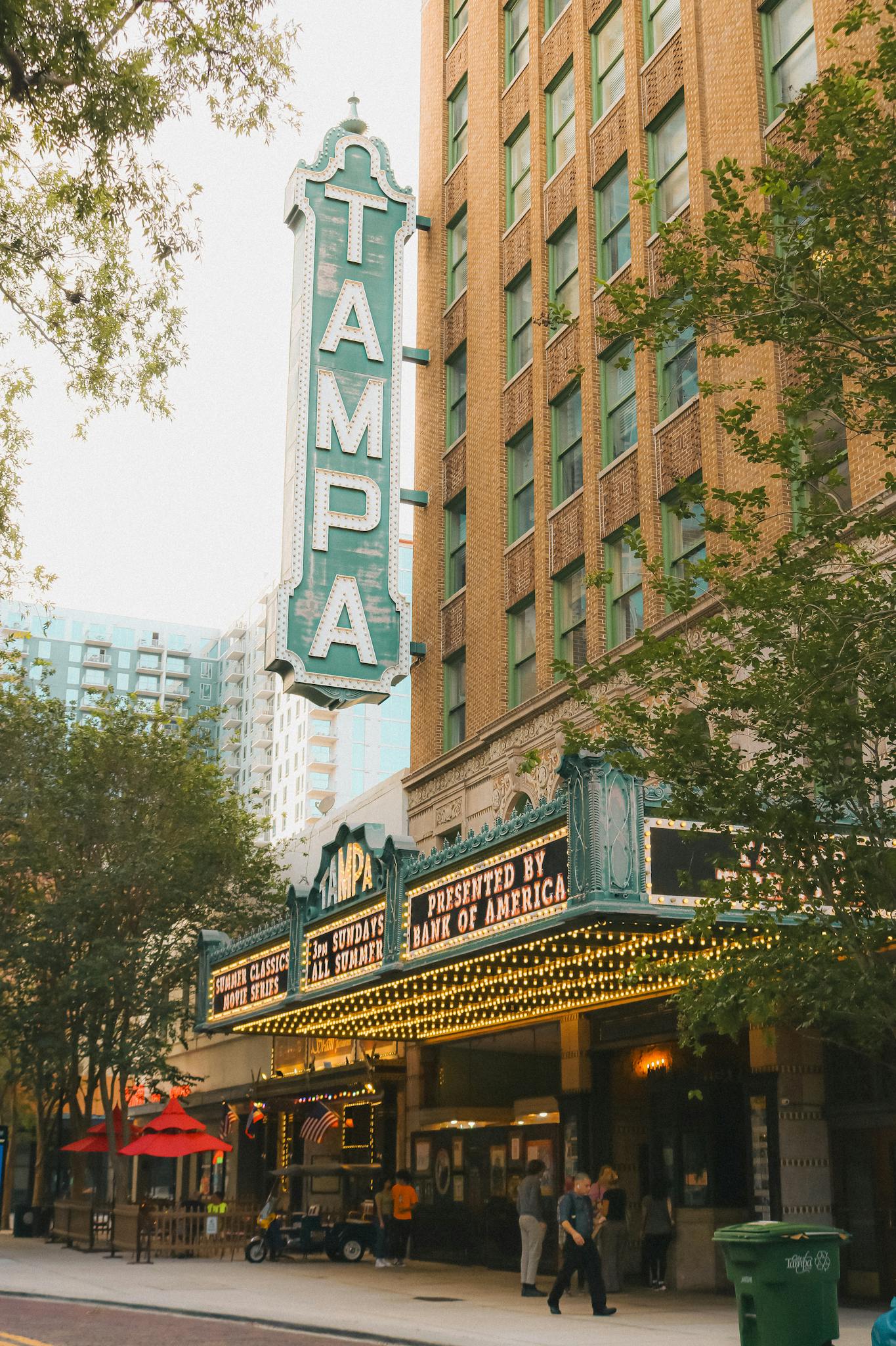 Historic Tampa Theater facade with vibrant signage in downtown Tampa, Florida.